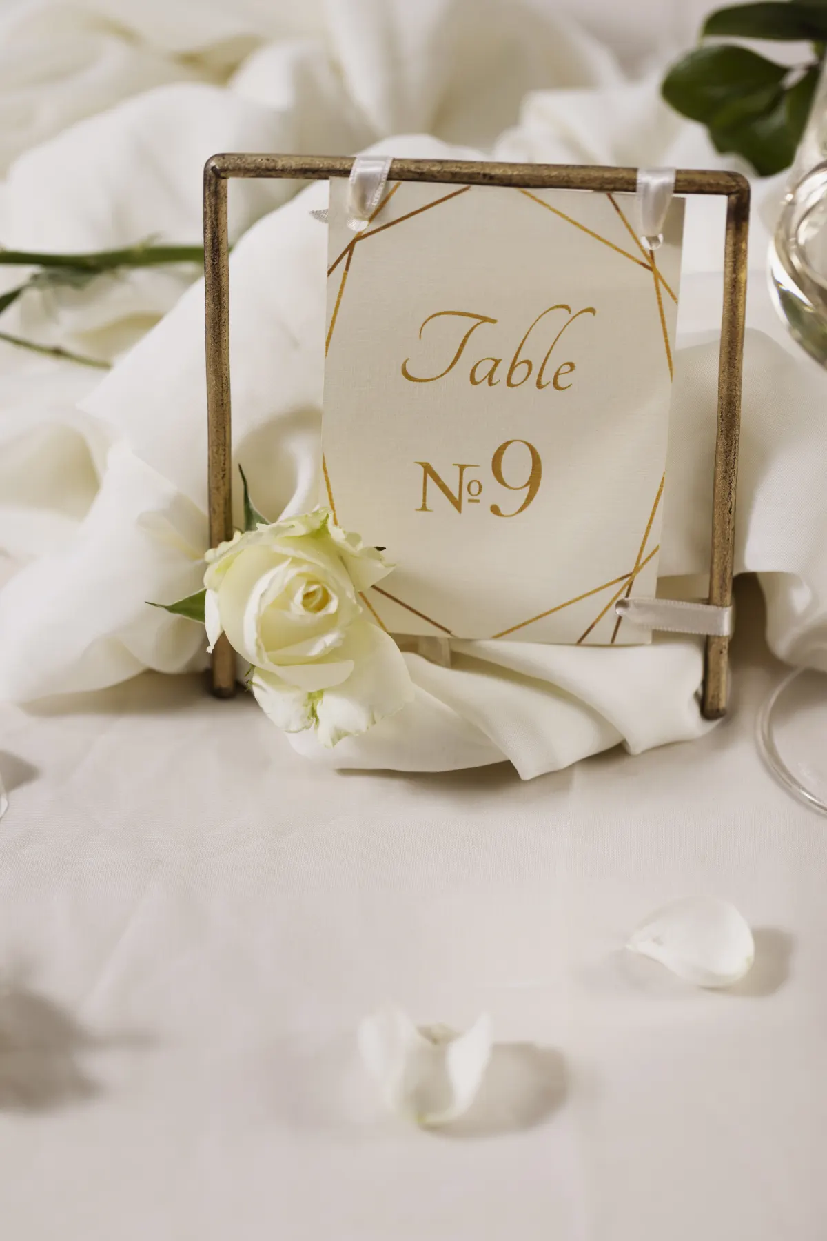 An elegant wedding table setting with flowers and a table number